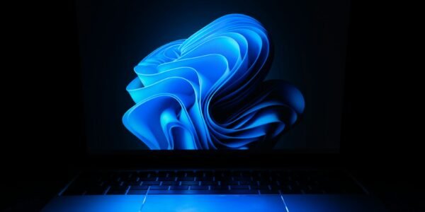 a macbook air laptop in the dark
